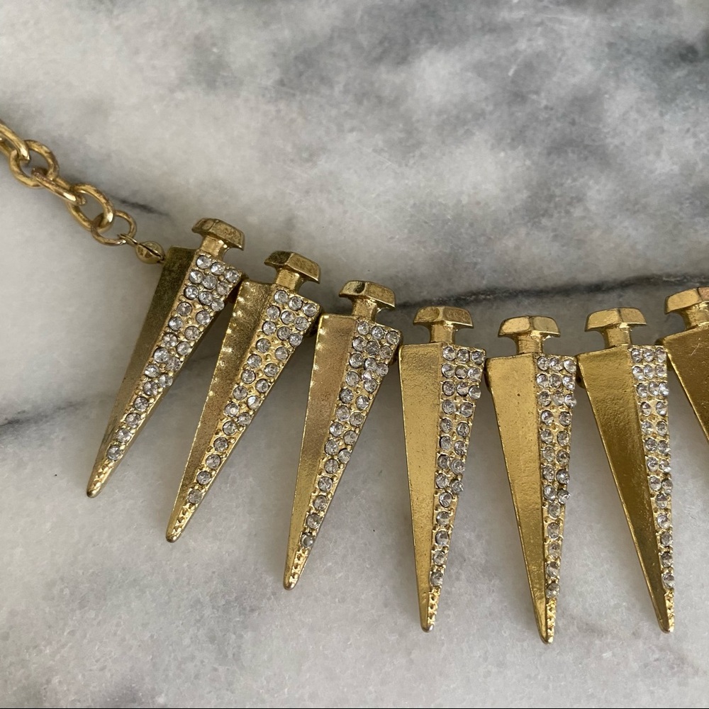 Spikes gold statement necklace with rhinestones